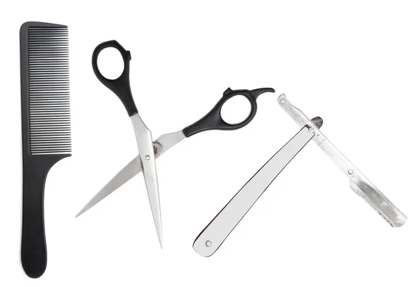 Comb with scissors and razor on a white background — Stock Photo, Image