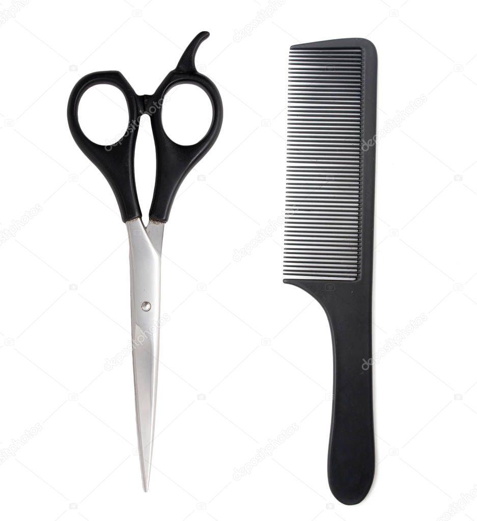 Comb with scissors on a white background