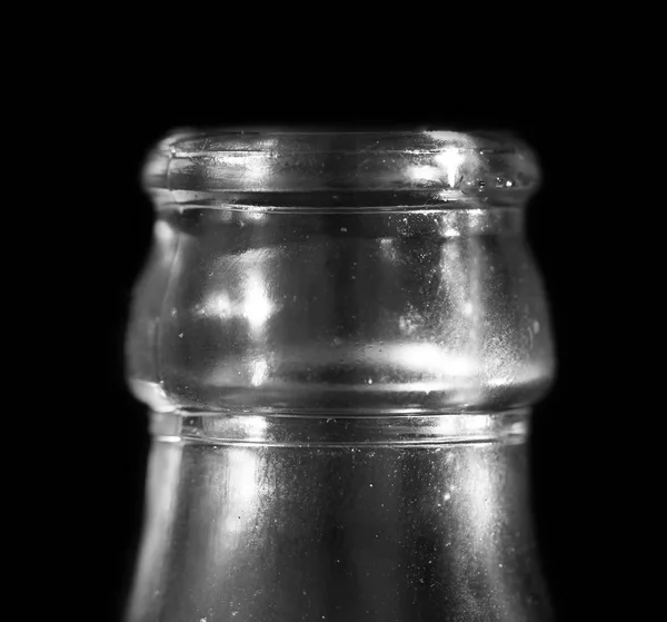 Glass bottle neck on a black background — Stock Photo, Image