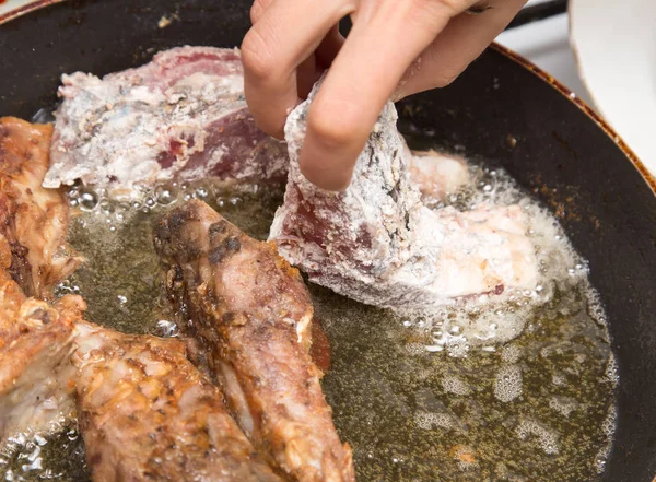 Fish is fried in a pan — Stock Photo, Image