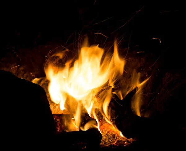 Fire with sparks on a black background — Stock Photo, Image