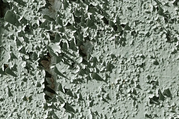 Old cracked paint on a wall as a background — Stock Photo, Image