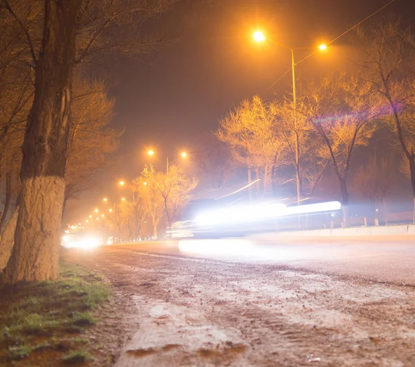 Road at night with moving cars — Stock Photo, Image