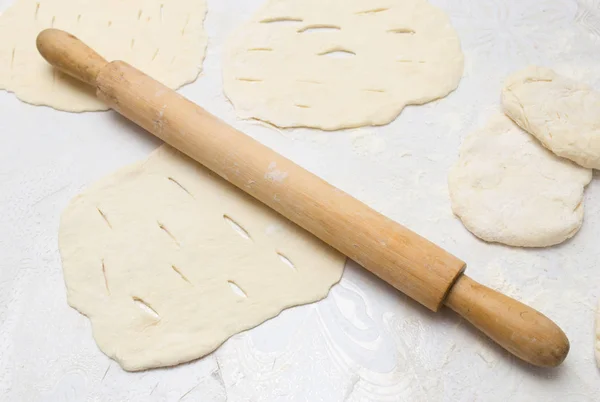 Rolling dough with a rolling pin — Stock Photo, Image