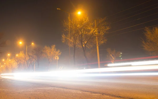 Road at night with moving cars — Stock Photo, Image