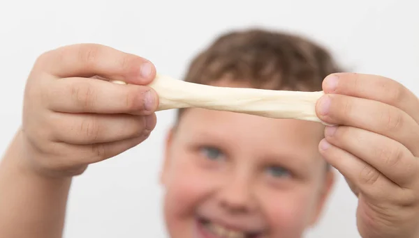 Boy with his hands in the dough — Stock Photo, Image