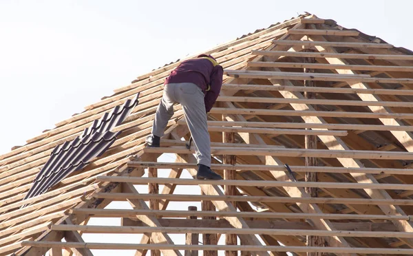 workers working on the roof