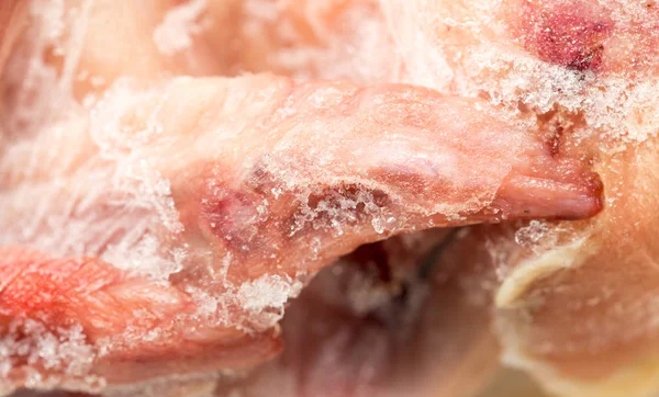 Frozen chicken as a background — Stock Photo, Image