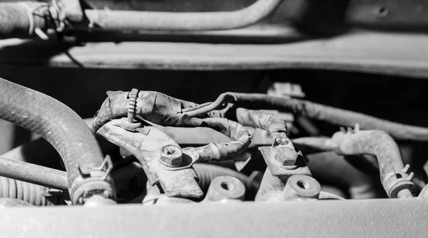 Old parts under the hood of a car — Stock Photo, Image