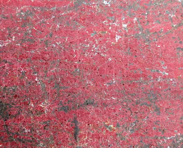 Achtergrond van oude metalen geschilderd rood met sporen van roest en verf — Stockfoto