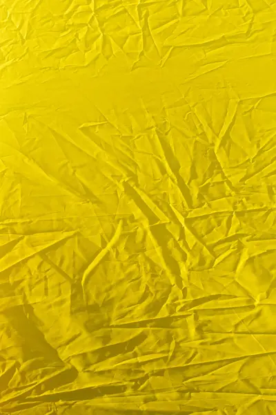 Tissu jaune ridé comme fond — Photo