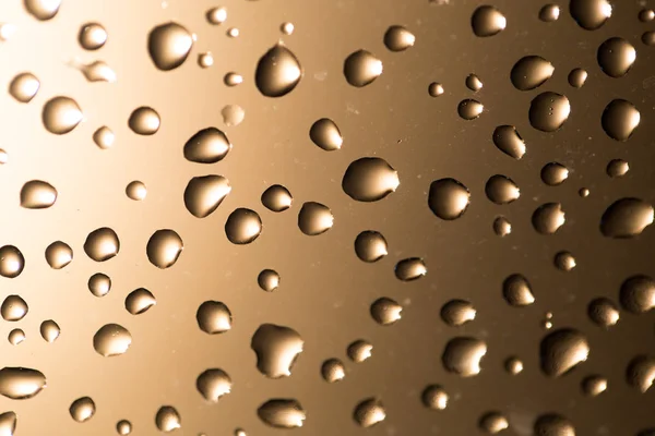 Gotas de agua en el vaso al atardecer —  Fotos de Stock