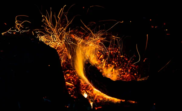 Fire with sparks on a black background — Stock Photo, Image