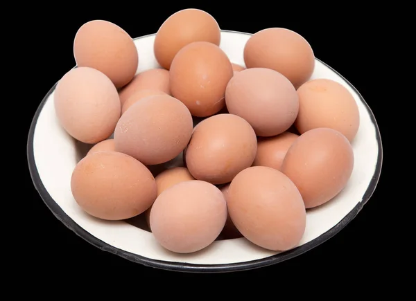 Boiled eggs in a bowl on a black background — Stock Photo, Image