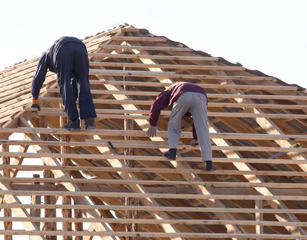 workers working on the roof