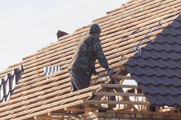 workers working on the roof