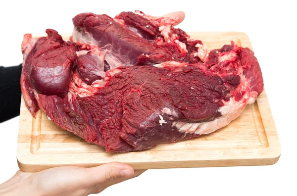 Fleisch auf einem Brett auf weißem Hintergrund — Stockfoto