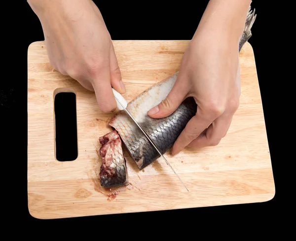 Preparation of herring on a board on a black background — Stock Photo, Image