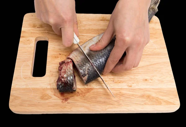 Preparation of herring on a board on a black background — Stock Photo, Image