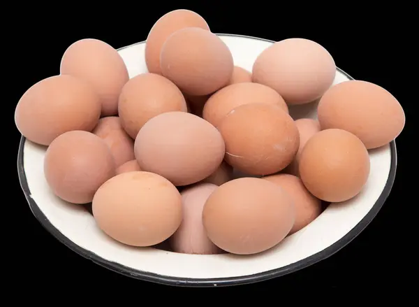 Boiled eggs in a bowl on a black background — Stock Photo, Image