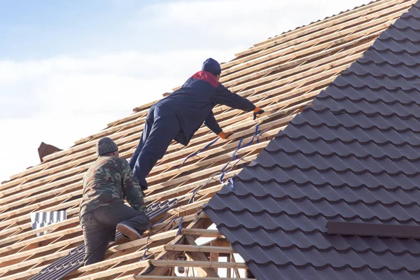 workers working on the roof