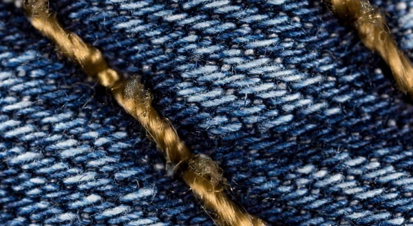 Thread on jeans as a background. macro — Stock Photo, Image