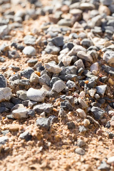 Cascalho com areia como fundo — Fotografia de Stock