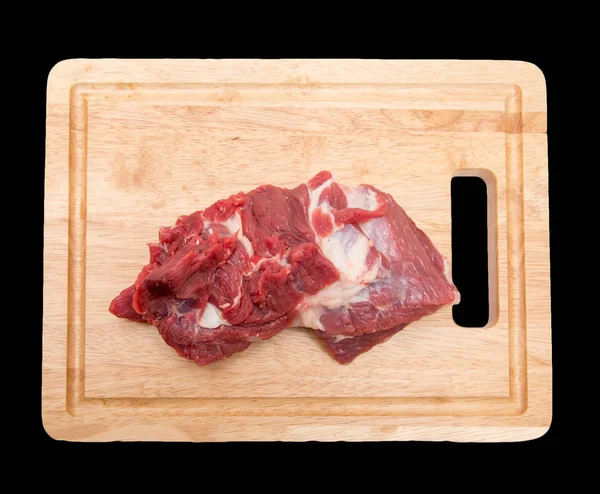 Vlees op het bord op een zwarte achtergrond — Stockfoto