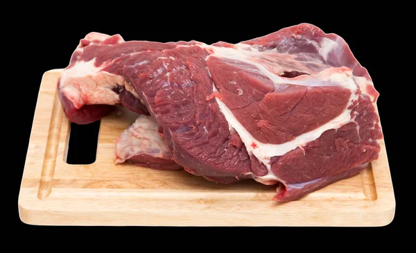 Carne sul bordo su uno sfondo nero — Foto Stock