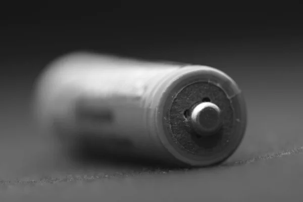 Battery on a black background. Macro — Stock Photo, Image