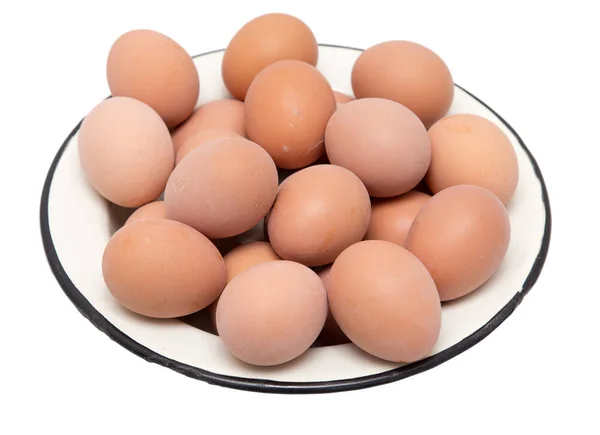 Eggs in a plate on a white background — Stock Photo, Image