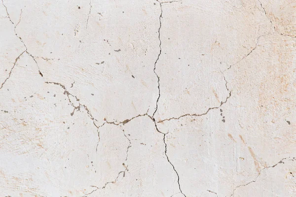 Cracked white wall as a background — Stock Photo, Image