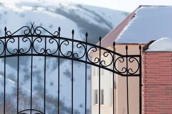 Metal fence outdoors in winter — Stock Photo, Image