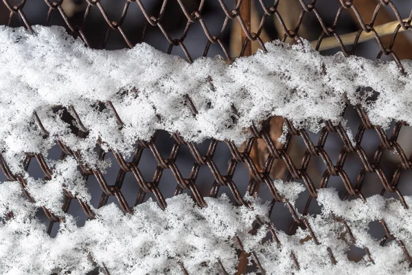 Nieve en la valla como telón de fondo —  Fotos de Stock