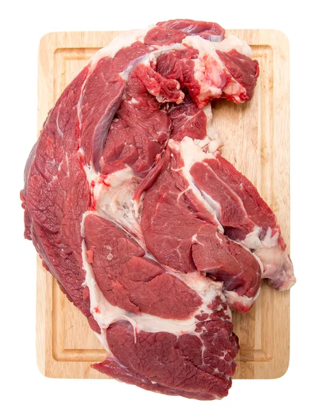 Carne em uma tábua em um fundo branco — Fotografia de Stock