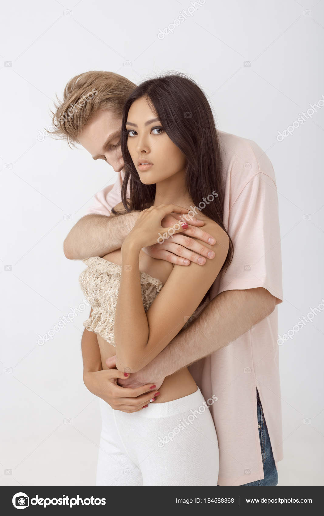 Interracial romantic couple in love Stock Photo by ©dimabl 184588368