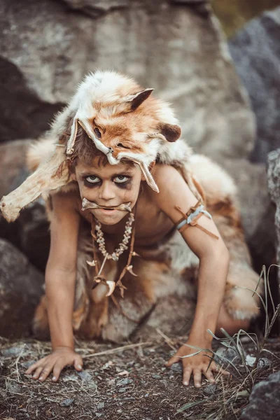 Caveman, manly boy hunting outdoors. Ancient warrior portrait. — Stock Image Caveman, manly boy hunting outdoors. Ancient warrior portrait. Stock Photo
