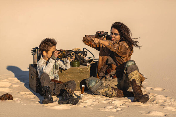 Post apocalyptic Woman and Boy Outdoors in a Wasteland