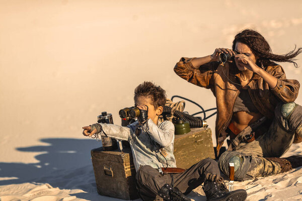 Post apocalyptic Woman and Boy Outdoors in a Wasteland