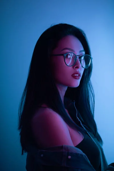 Studio Portrait of Asian Woman Over Urban Neon Lights. — Stock Photo, Image