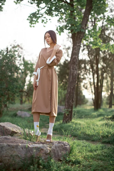 Asian woman in traditional japanese kimono outdoors