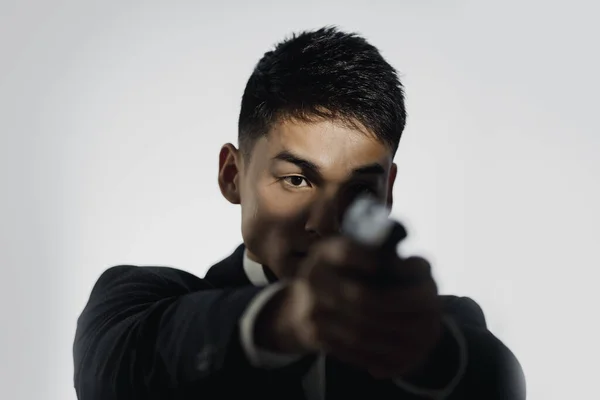 Portrait of Elegant Spy in Suit With Weapon — Stock Photo, Image