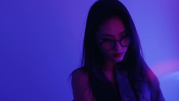 Studio Portrait of Asian Woman with Neon Lights. — Stock Video