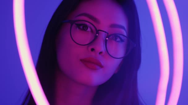 Studio Portrait of Asian Woman with Neon Lights. — Stock Video
