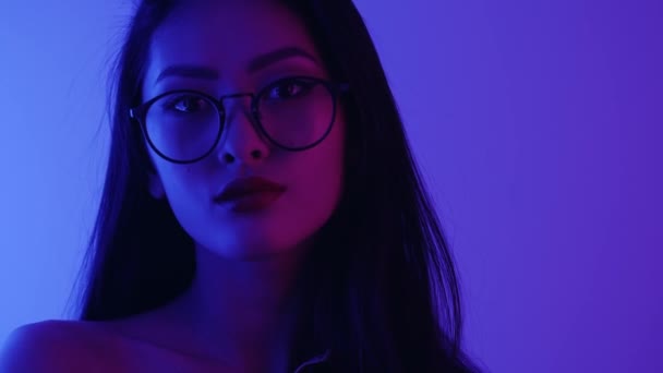 Studio Portrait of Asian Woman with Neon Lights. — стокове відео