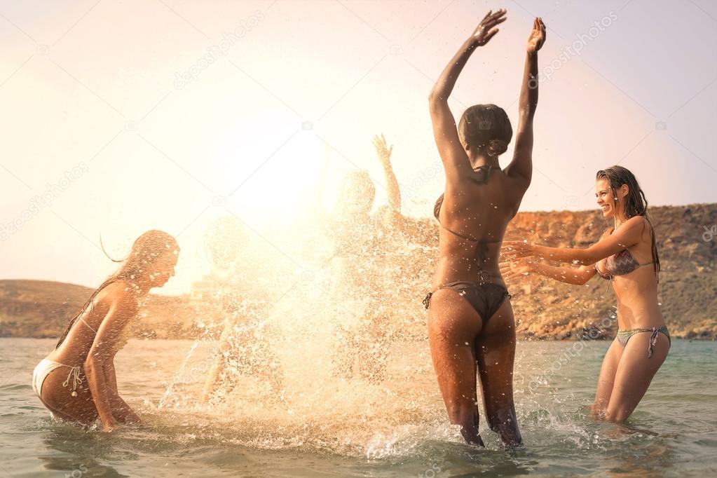girls are olaying in the sea