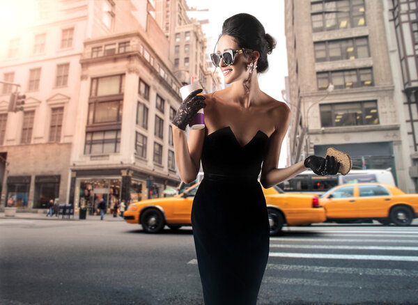 woman in black dress in the city