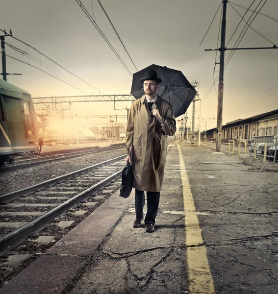 Man with an umbrella Stock Picture