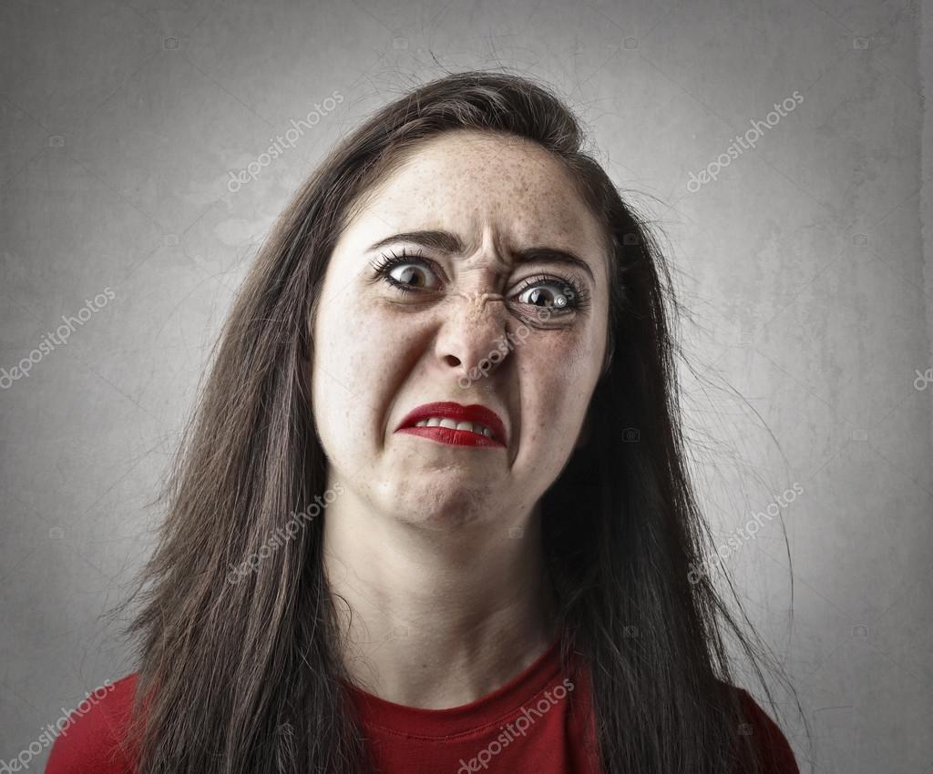 Woman making a disgusted face Stock Photo by ©olly18 126137640