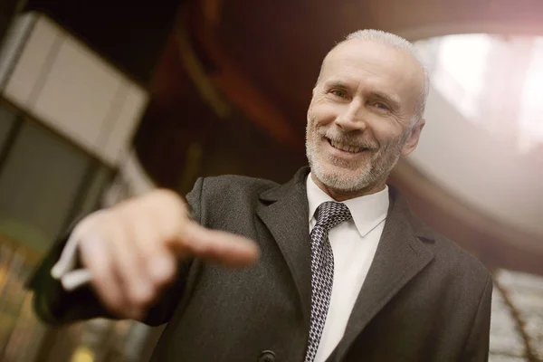 Older businessman reaching for your hand — Stock Photo, Image